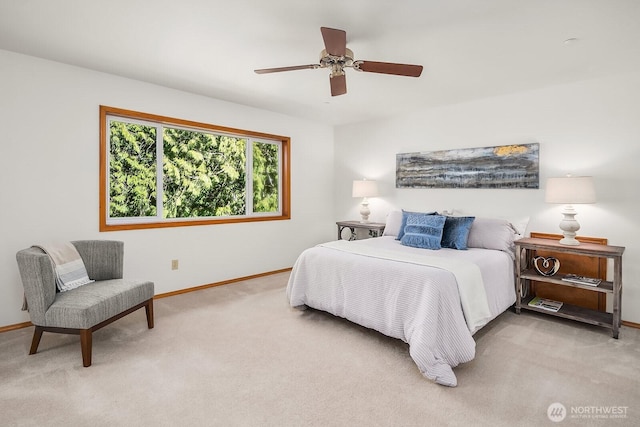 carpeted bedroom with a ceiling fan and baseboards