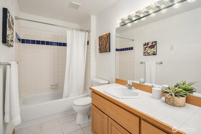 full bath with visible vents, toilet, tile patterned floors, shower / bath combo with shower curtain, and vanity