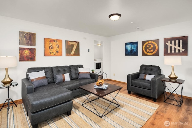 living room featuring wood finished floors and baseboards