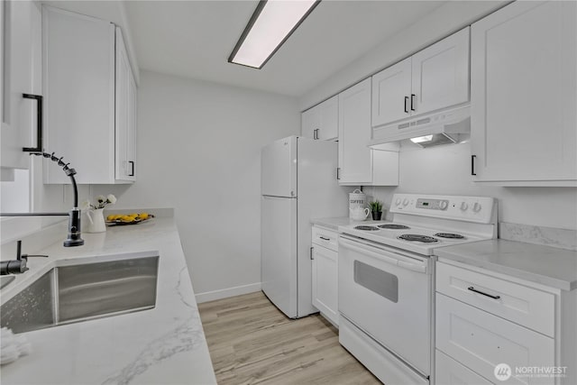 kitchen featuring light wood-style flooring, white cabinetry, light stone countertops, white appliances, and under cabinet range hood