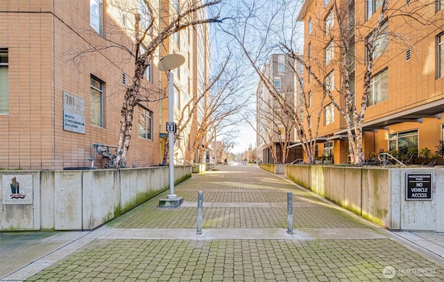 view of road with a residential view and street lights