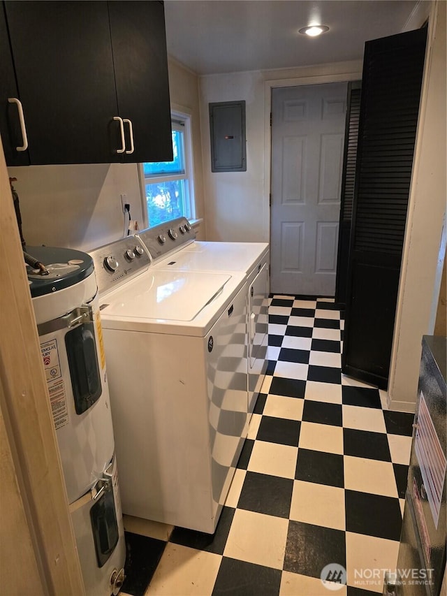 kitchen featuring washing machine and clothes dryer, light floors, light countertops, dark cabinets, and electric panel