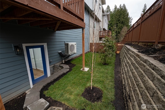 view of yard featuring ac unit and fence