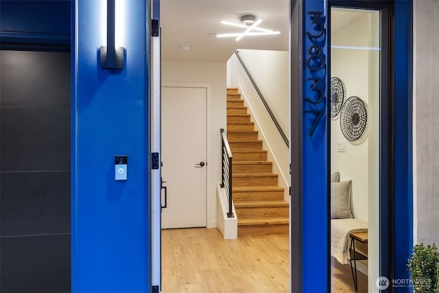 stairway with wood finished floors