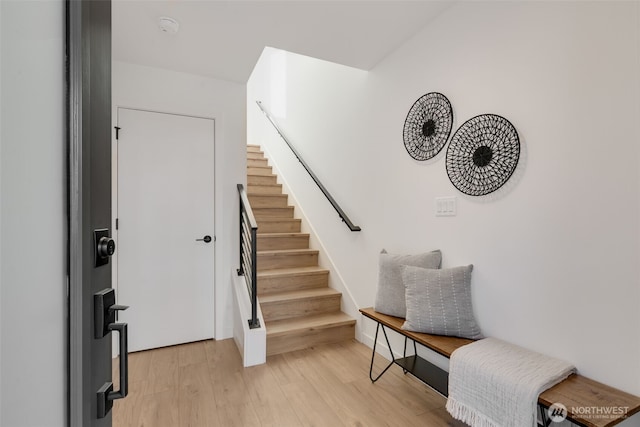 entryway with stairway and light wood-type flooring