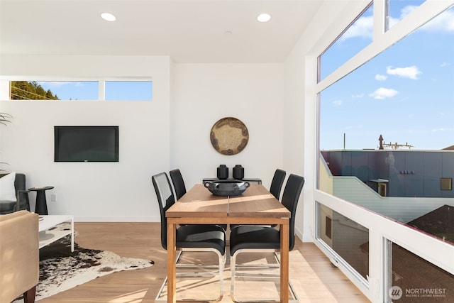 dining area with recessed lighting, light wood-type flooring, and baseboards