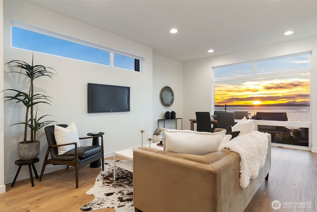 living area with recessed lighting and light wood-type flooring