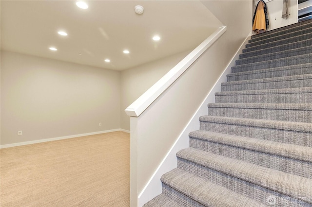 stairs with carpet floors, recessed lighting, and baseboards