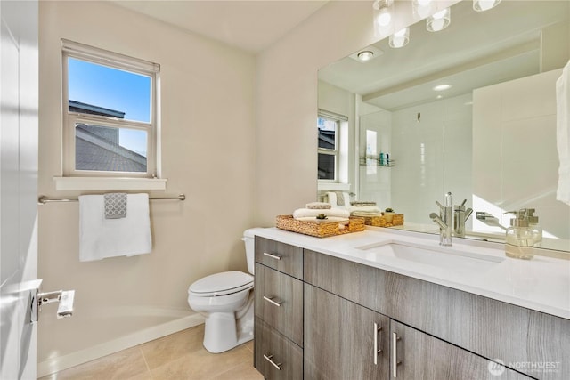 full bathroom featuring tile patterned flooring, baseboards, vanity, and toilet