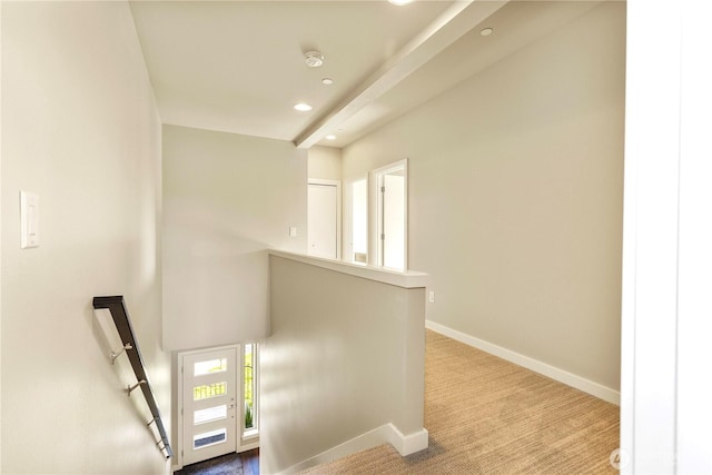 corridor featuring carpet floors, recessed lighting, baseboards, and an upstairs landing