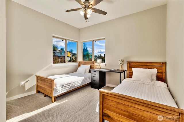 bedroom featuring a ceiling fan, carpet flooring, and baseboards