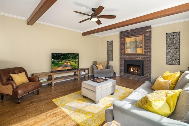 living area with ornamental molding, wood finished floors, and beam ceiling