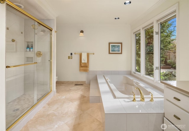 bathroom featuring ornamental molding, a stall shower, toilet, and a tub with jets