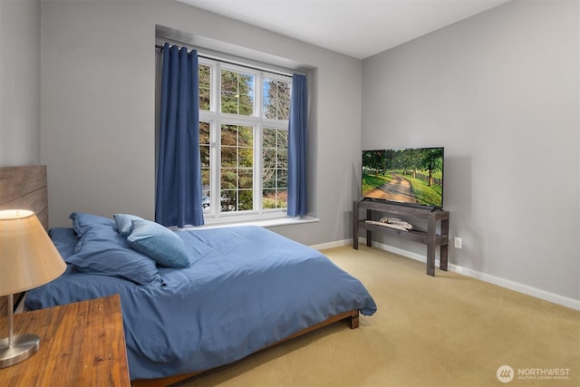 bedroom featuring carpet floors and baseboards