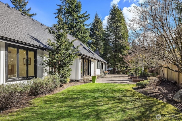 view of yard with a patio area and a fenced backyard