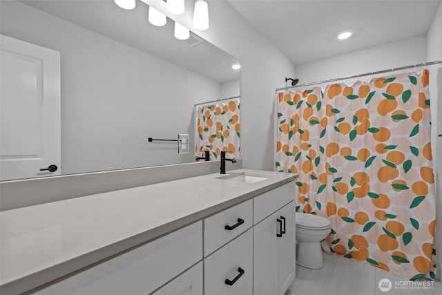 bathroom featuring vanity, toilet, a shower with curtain, and tile patterned flooring