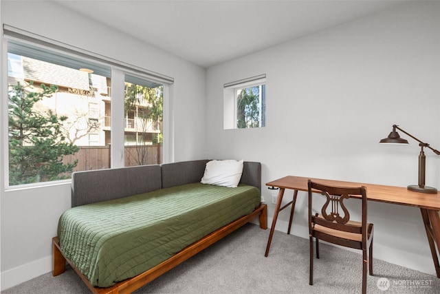 carpeted bedroom with baseboards