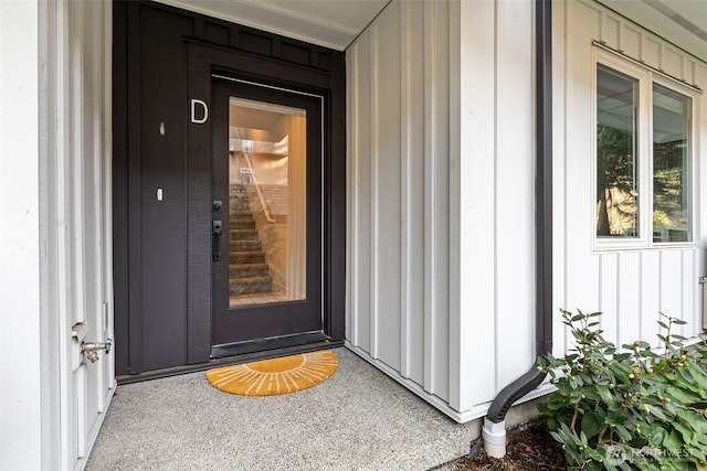 doorway to property with board and batten siding