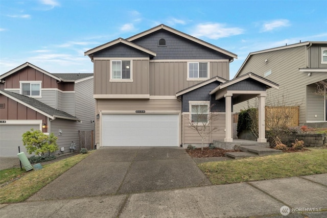 view of front of house featuring board and batten siding, an attached garage, and driveway