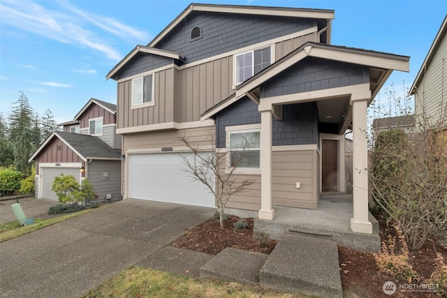 craftsman-style house featuring board and batten siding, concrete driveway, and an attached garage