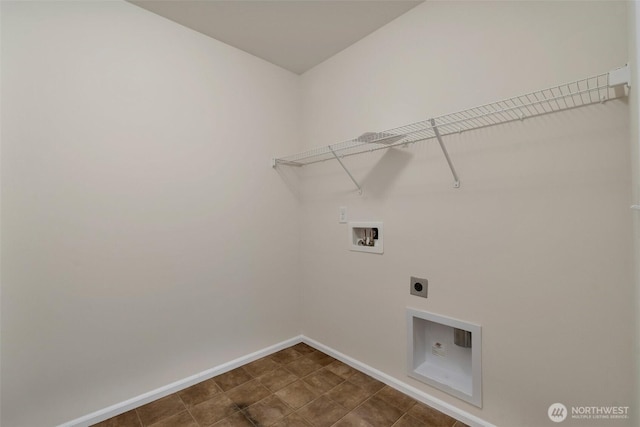 laundry area with baseboards, hookup for an electric dryer, hookup for a washing machine, and laundry area