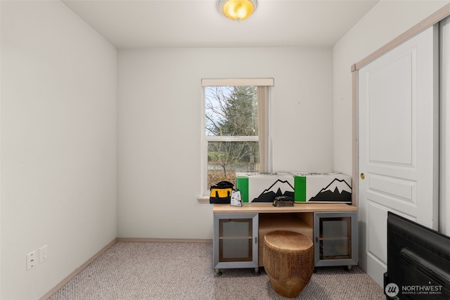 home office featuring baseboards and carpet floors