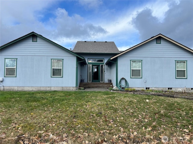 single story home featuring a front lawn