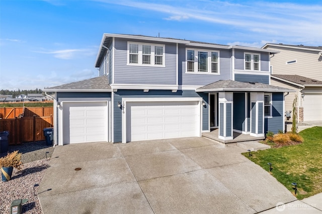 view of front of home featuring a garage, fence, driveway, and a shingled roof