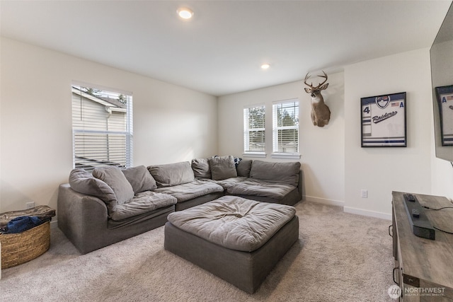 carpeted living room featuring recessed lighting and baseboards