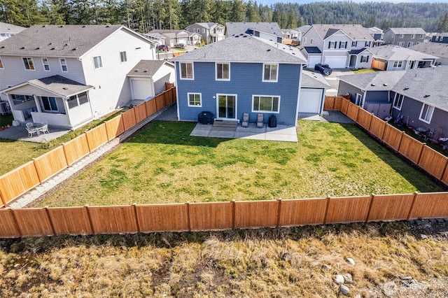 back of property featuring a patio area, a fenced backyard, and a residential view