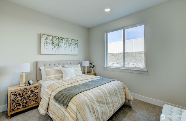 carpeted bedroom featuring recessed lighting and baseboards