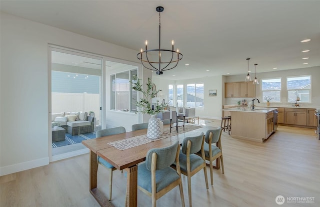 dining area featuring a wealth of natural light, light wood-type flooring, baseboards, and recessed lighting