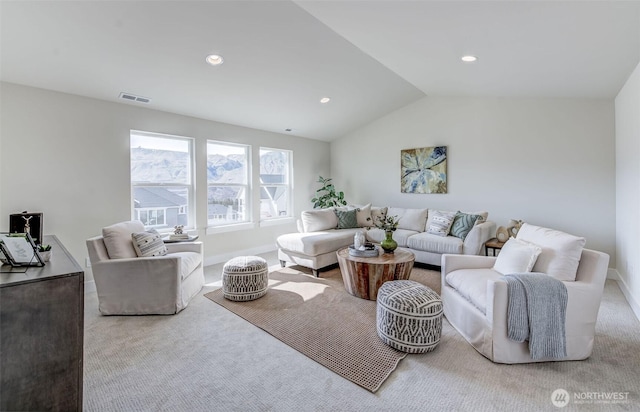 carpeted living room featuring recessed lighting, visible vents, baseboards, and vaulted ceiling