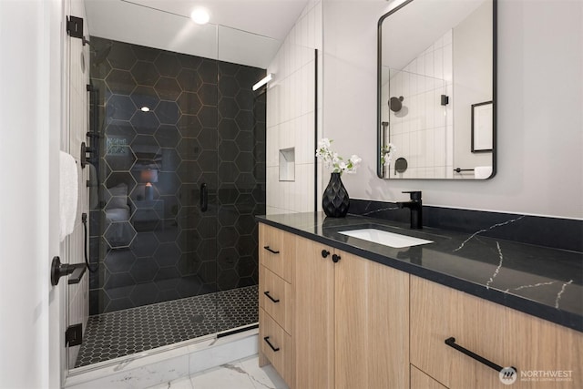 full bath featuring a stall shower and vanity