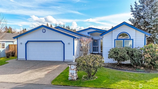 ranch-style home with concrete driveway and a front yard