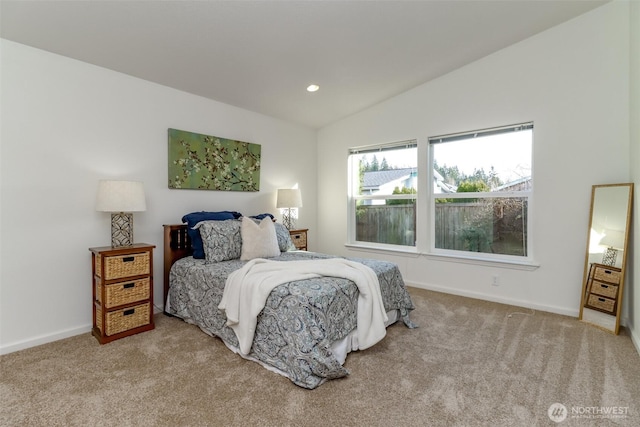 bedroom featuring lofted ceiling, carpet flooring, and baseboards