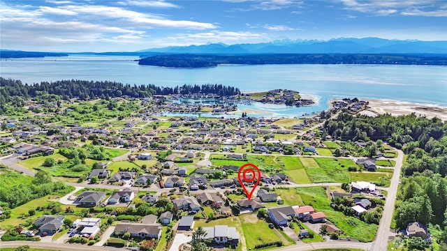 bird's eye view featuring a residential view and a water and mountain view