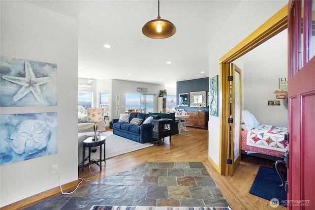 corridor featuring recessed lighting, wood finished floors, and baseboards