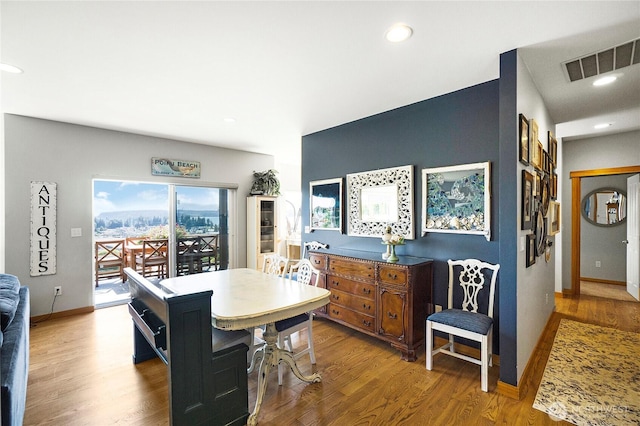 dining area with recessed lighting, visible vents, baseboards, and wood finished floors