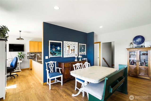 dining room featuring recessed lighting and light wood-type flooring