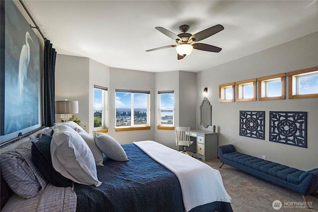 carpeted bedroom with ceiling fan