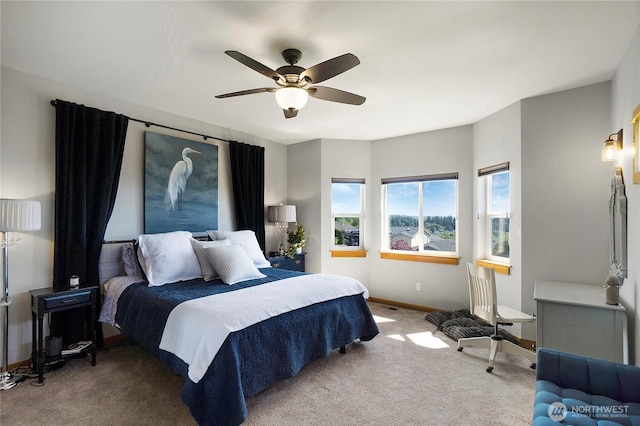 bedroom with carpet flooring, baseboards, and ceiling fan