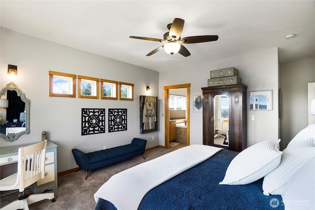 carpeted bedroom with baseboards, ensuite bathroom, and ceiling fan