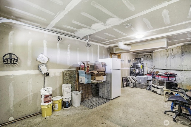 basement with freestanding refrigerator