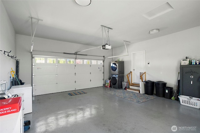 garage with stacked washer / dryer and a garage door opener