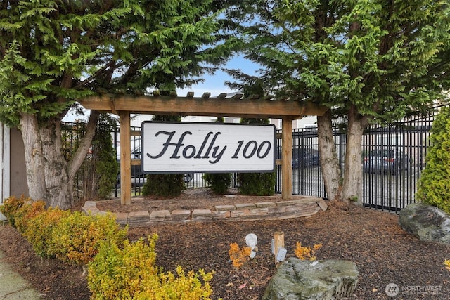 community sign with fence