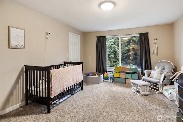 bedroom featuring carpet floors and baseboards