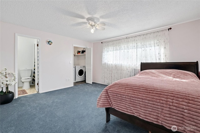 carpeted bedroom featuring a textured ceiling, ensuite bath, a ceiling fan, and washer and clothes dryer