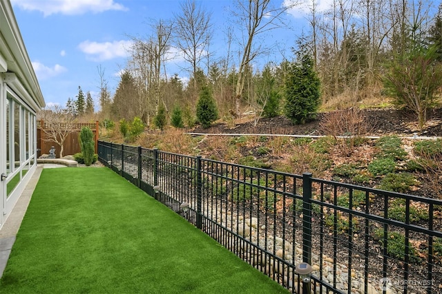 view of yard with a fenced backyard