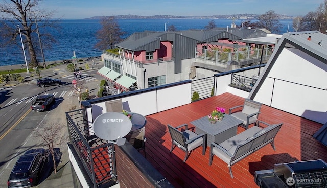 wooden deck with a water view